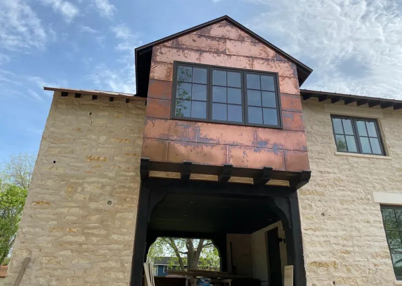 Copper metal panel facade on a stone building for Skylight Installation in Brownsburg